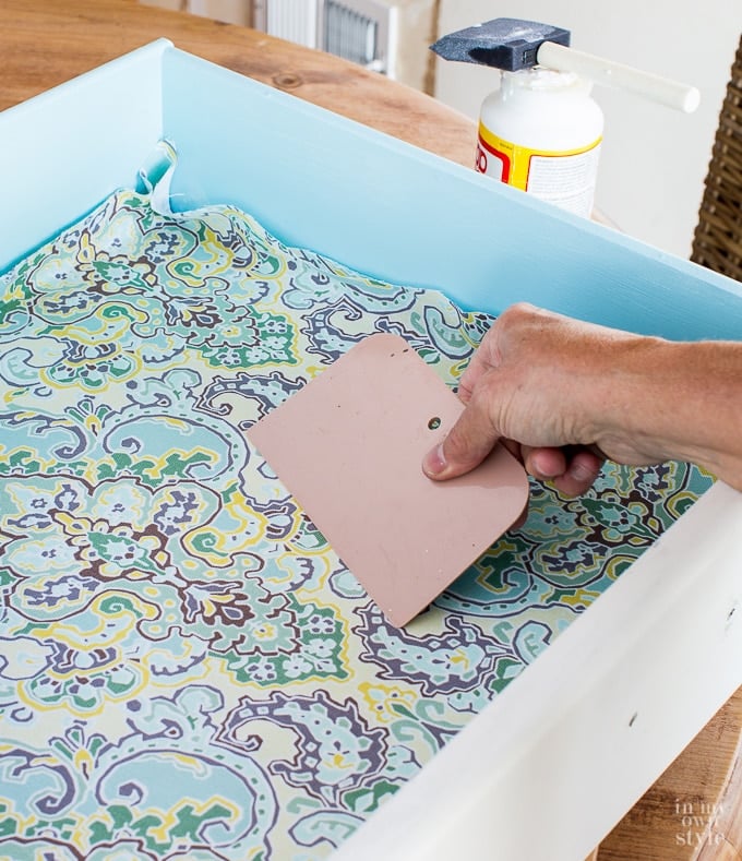 How to attach fabric to the inside of a dresser drawer