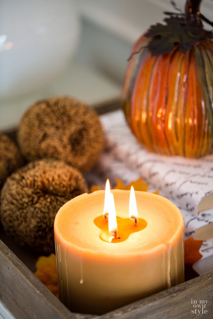 Decorating for fall with candles and pumpkins