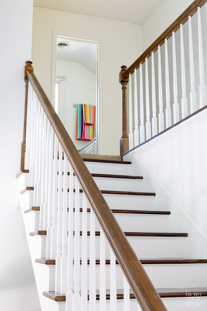 Staircase makeover showing how to remove carpet and paint risers and stain steps for a clean modern look