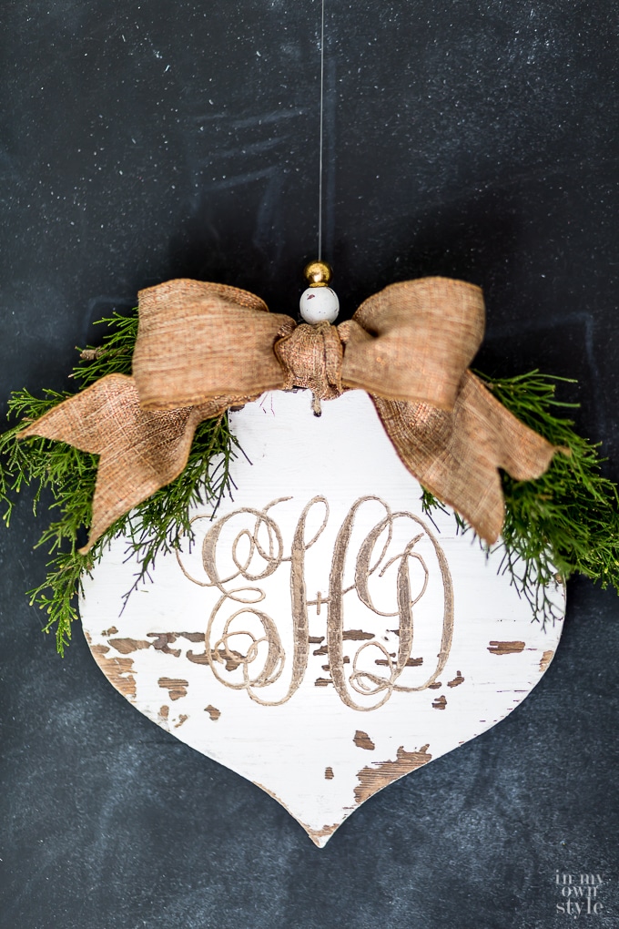 carved-monogram-into-a-rustic-wood-christmas-ornament