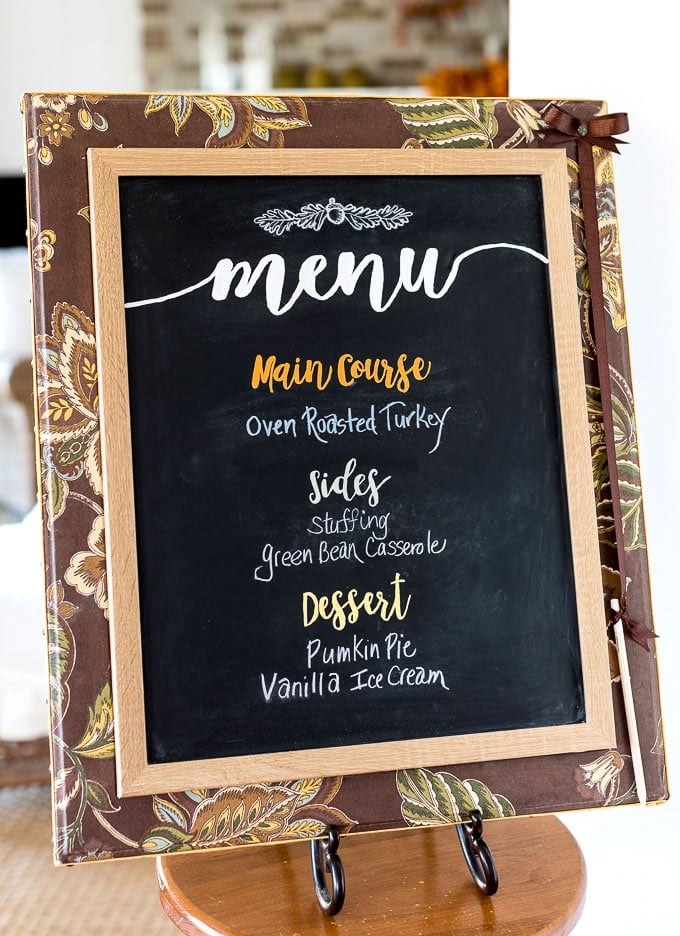 Fabric covered chalkboard in stand in a kitchen