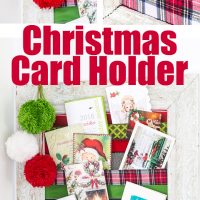 DIY Christmas card holder to display holiday cards all season long. It uses ribbons.