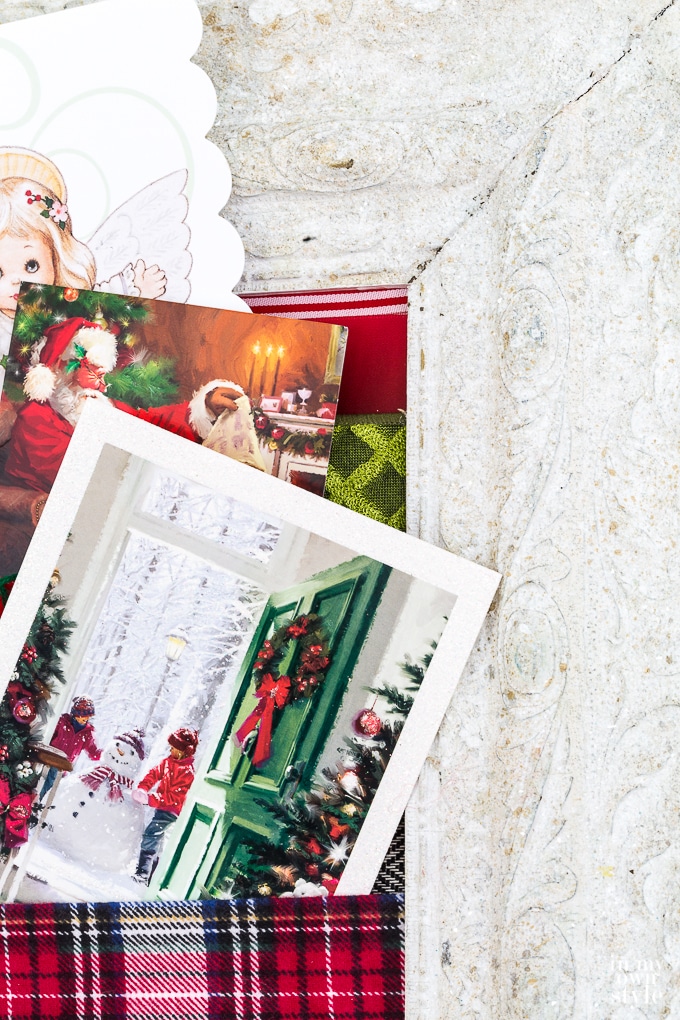 Display Christmas cards in style by making a Christmas card holder using ribbon and a frame.