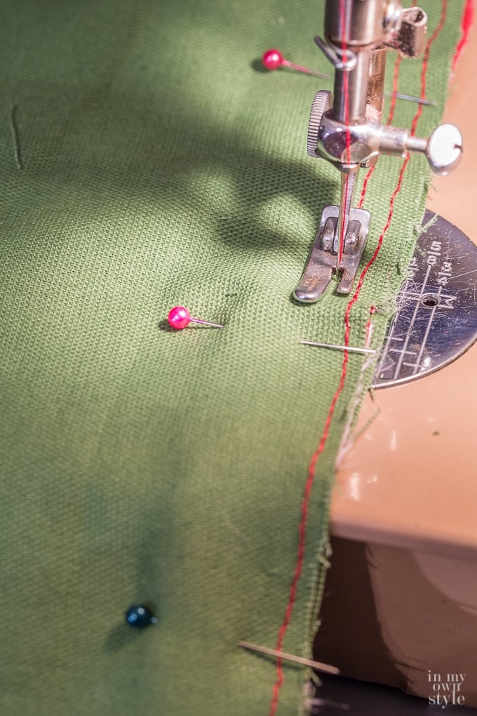 Sewing a throw pillow cover on a sewing machine.