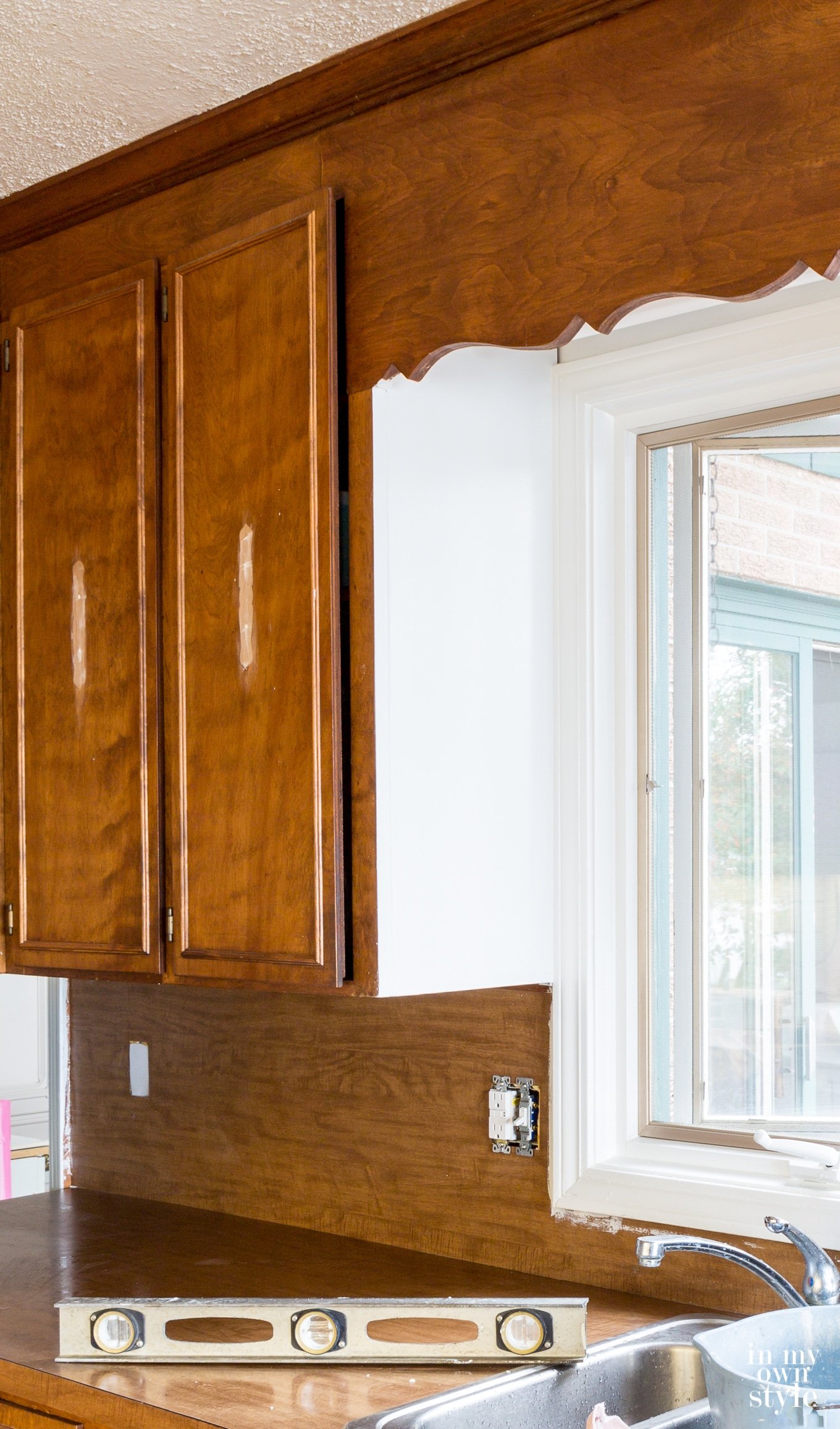 Kitchen backsplash before adding white subway tiles