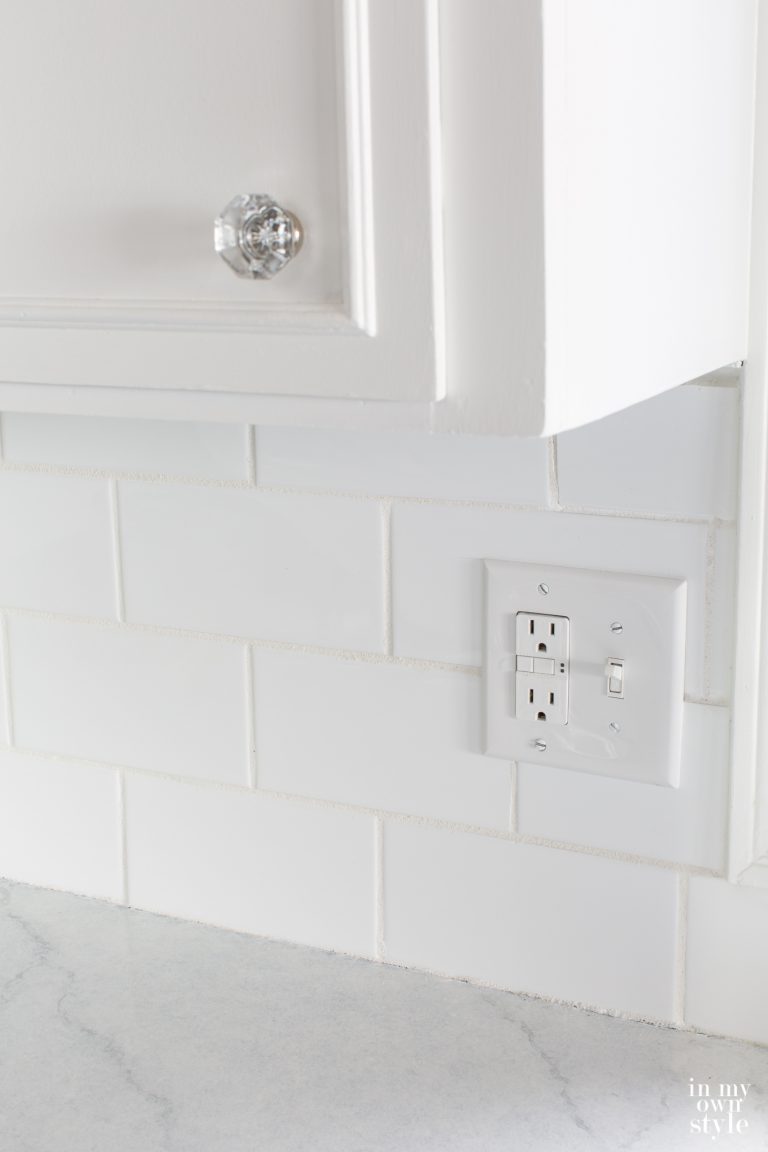 White Subway tiles and grout on kitchen backsplash