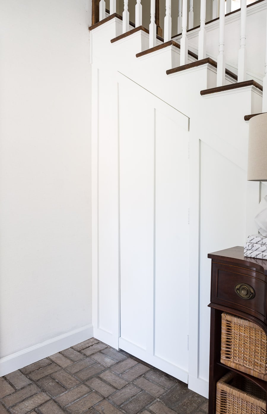 Board and batten hidden door under a staircase