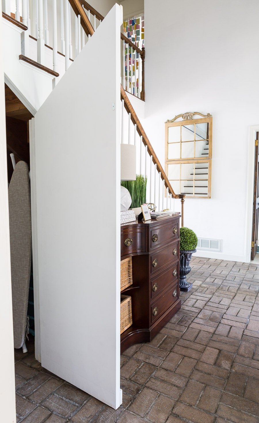 Angled hidden door under staircase closet