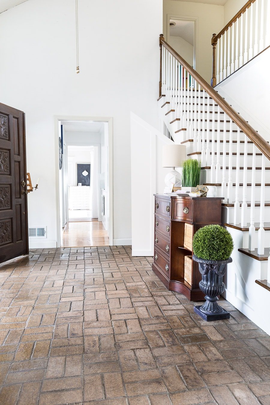 dark brown brick floor in large open foyer