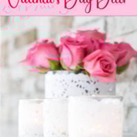 trio of doily wrapped glass candle holders on a white mantel.