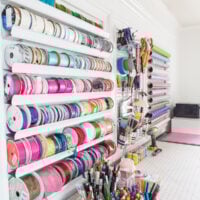 Craft room organization on a wall in a home craft room office