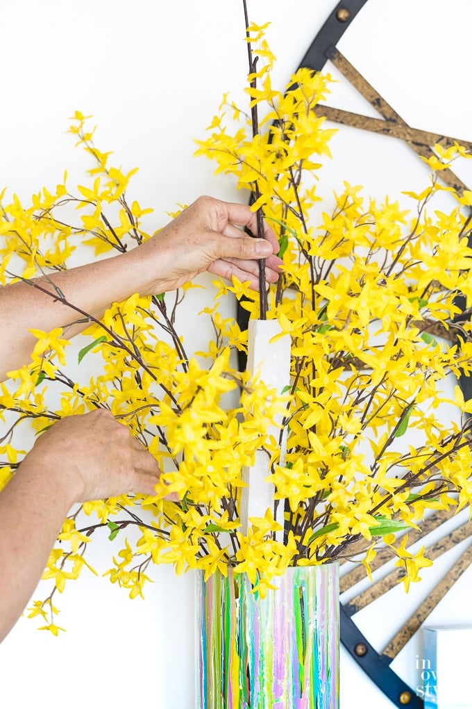 Arranging spring flowers in a vase