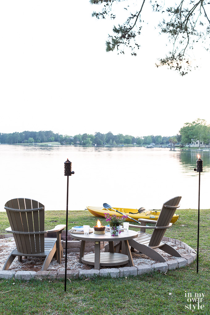 TIKI Tabletop Firepiece with Clean Burn System on a table by the lake