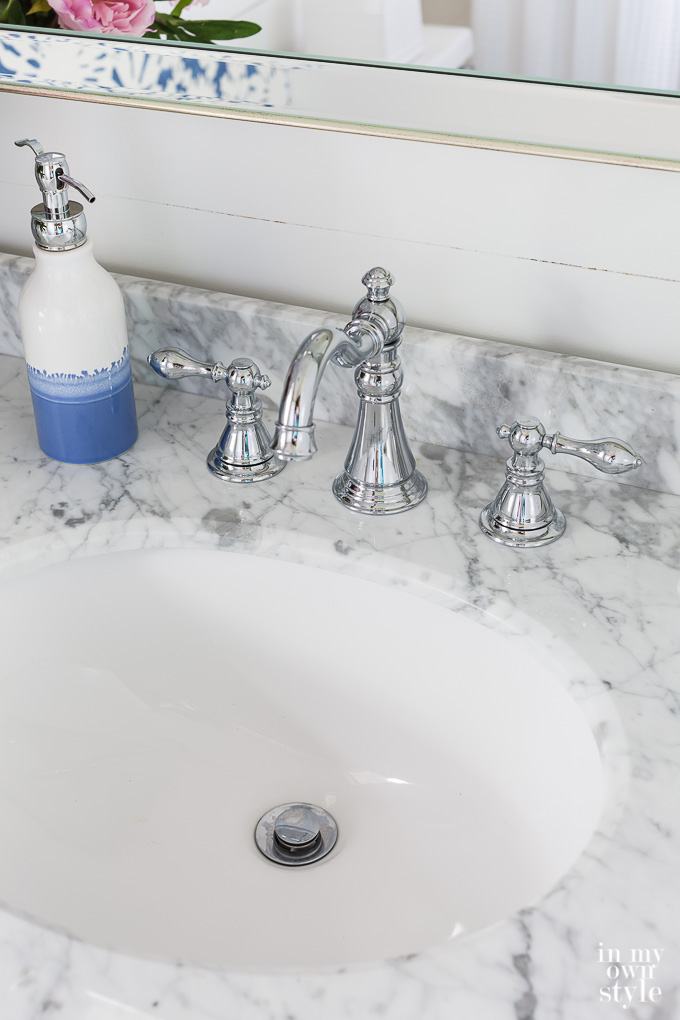 Marble topped vanity in small bathroom