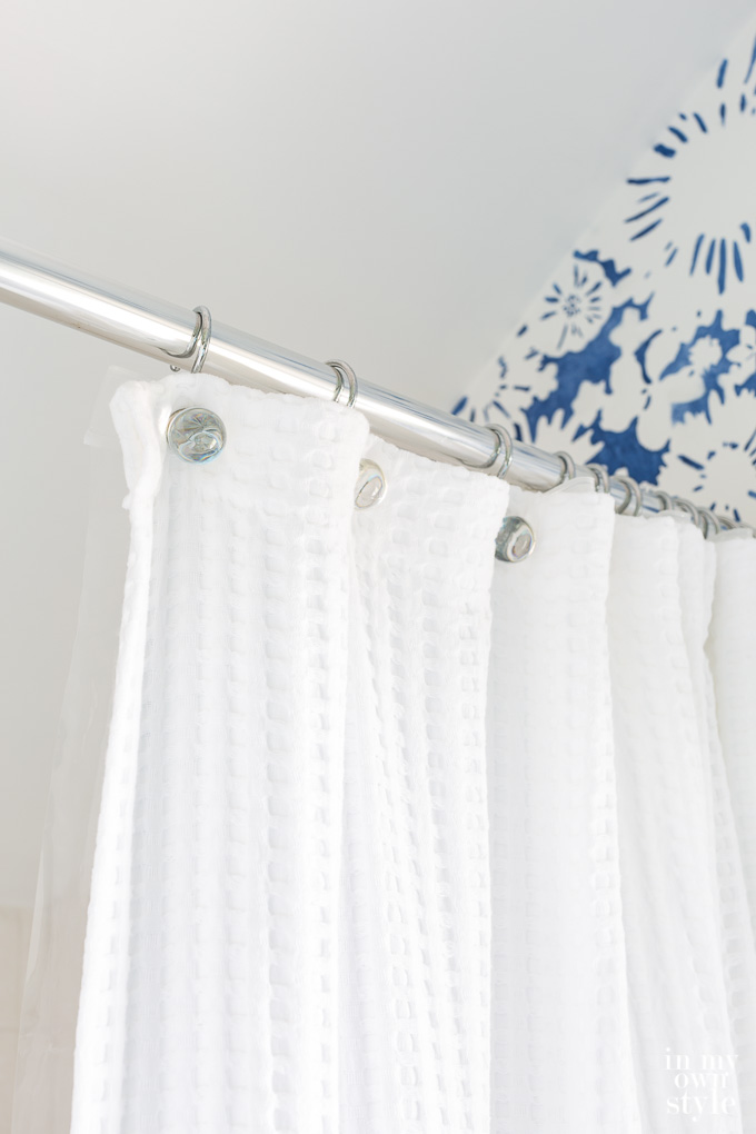 Waffle Hotel shower curtain in small bathroom