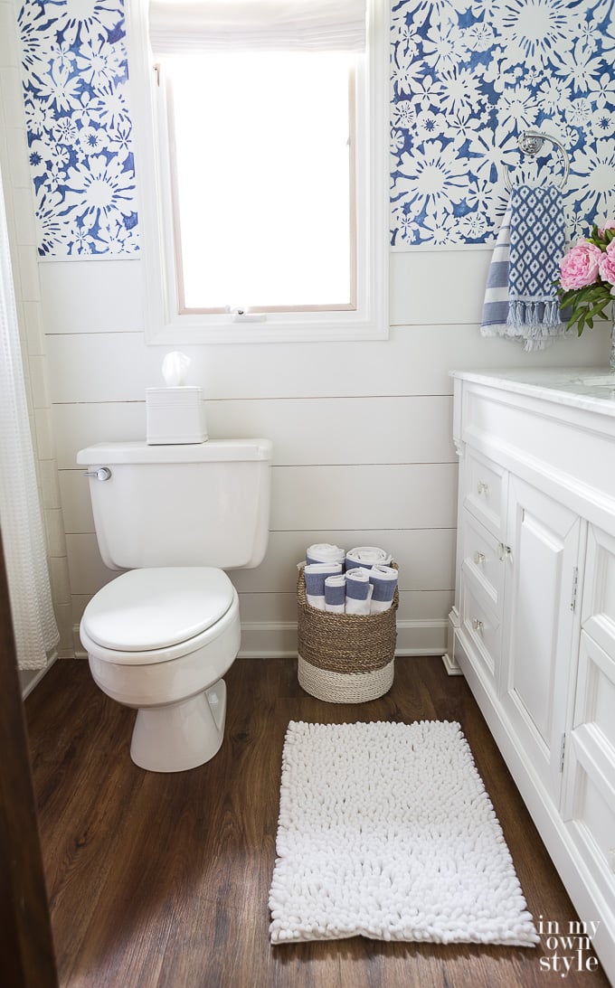 Budget Decorating a small bathroom using a blue and white color scheme.