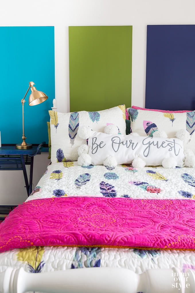 Be Our Guest pillow in colorful bedroom