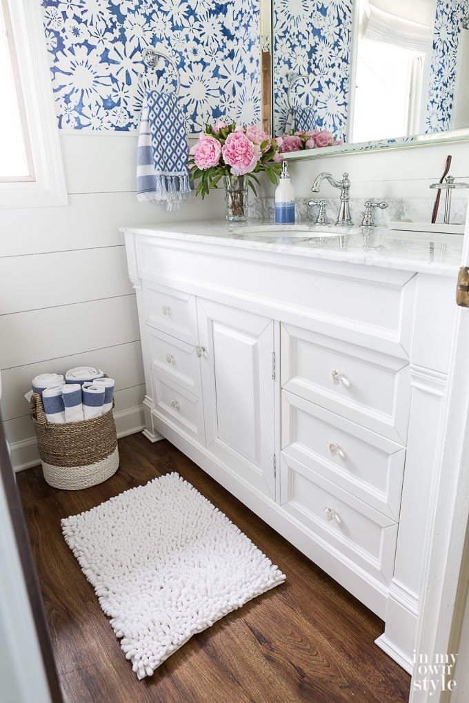 Blue and white floral stenciled walls in bathroom