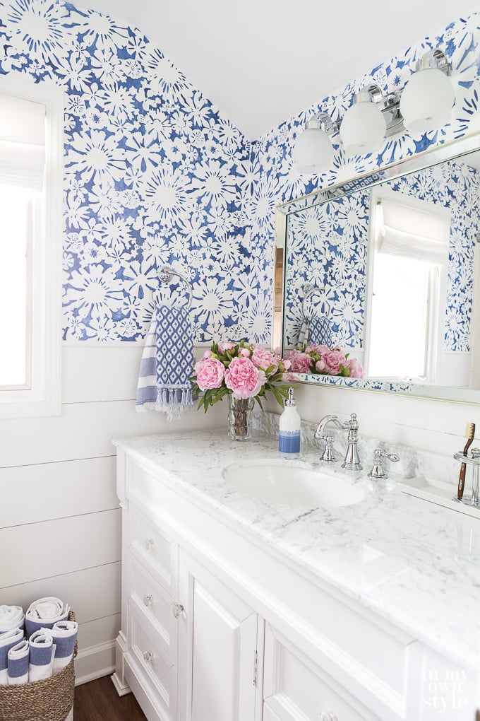 Blue and white bathroom decorating color palette that brightens a dark room