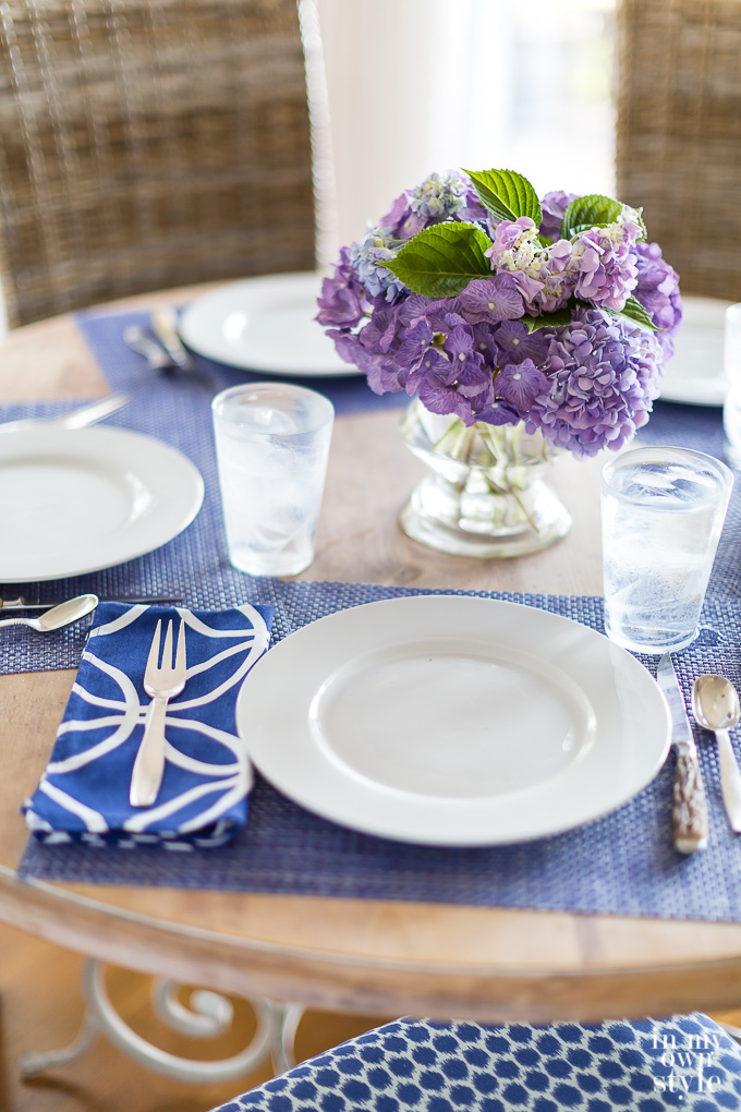 Pretty blue and white table setting with custom made chair cushions