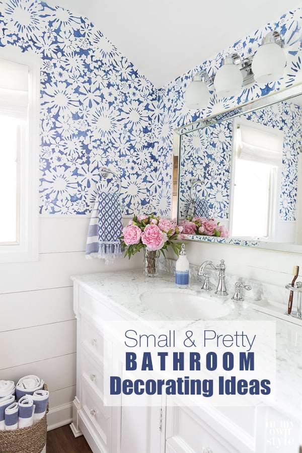 Blue and White small bathroom with stenciled walls and white vanity.