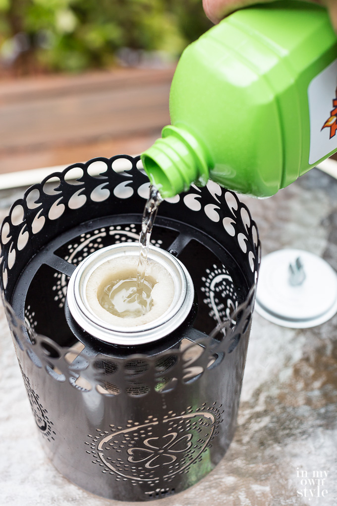 Outdoor summer entertaining tip. Use a TIKI Brand Tabletop Firepiece with plant based Clean Burn fuel to light up your table in elegant style. The Roundwick burner creates a brighter glow than other fuels and candles.