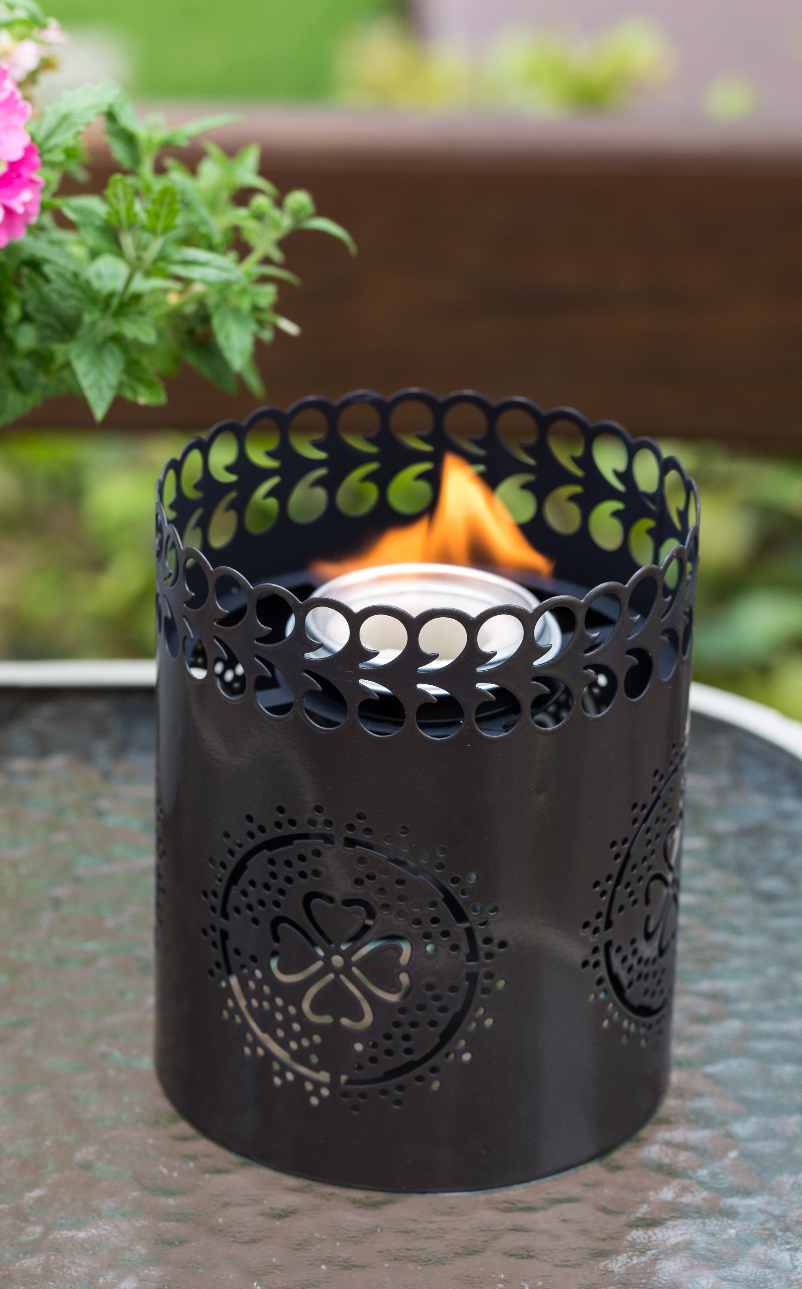 Outdoor table setting ideas that will add night time ambiance. TIKI Brand Tabletop Firepiece with FlameShied in the color Gun Metal.