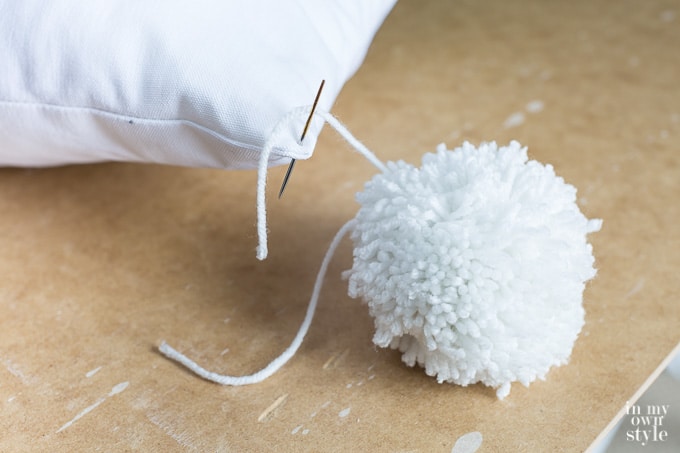 How to attach a pom-pom to a pillow
