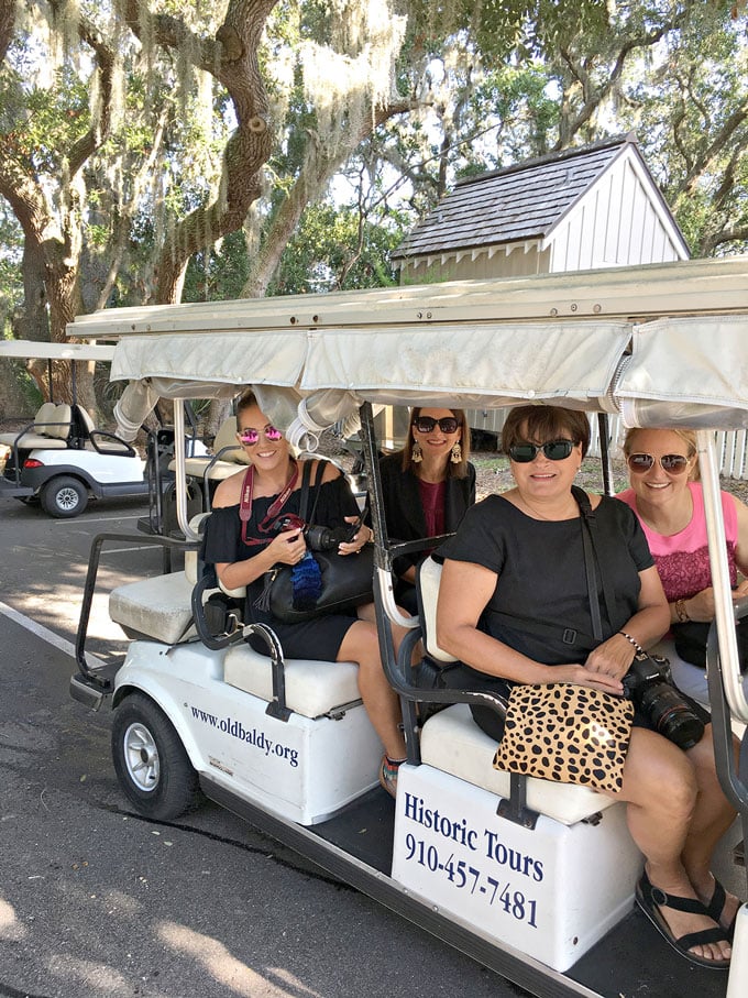 Riding-in-golf-carts-to-get-around-on-Bald-Head-Island-NC