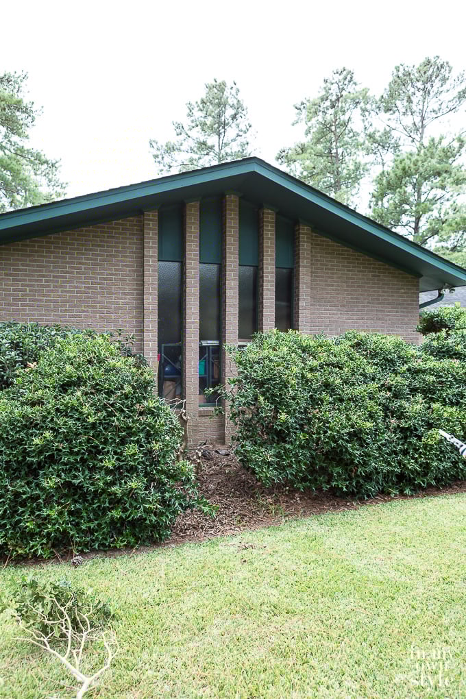 1970's ranch style home before exterior makeover on a budget using paint and landscaping.
