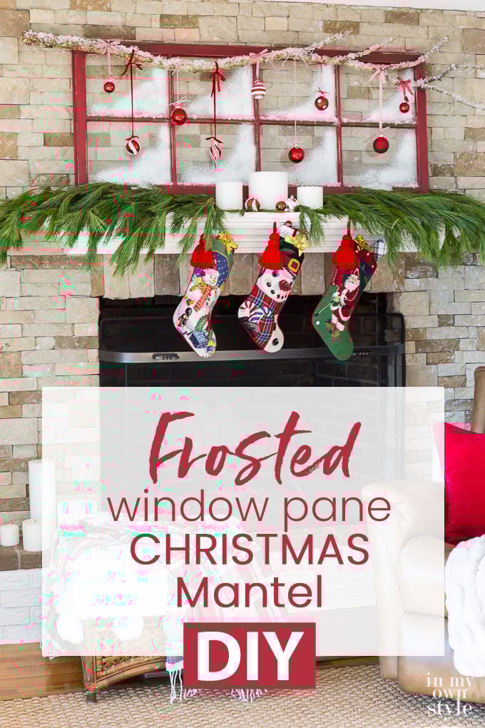 Christmas decorated mantel using an old red window sash and ornaments