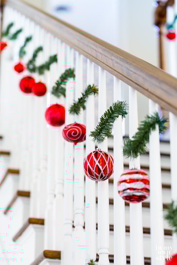 Creative ways to use Christmas garland ties. Garland ties on a staircase.