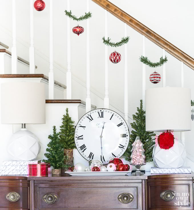 Christmas Staircase Decorating Idea using Garland Ties and shatterproof ornaments.