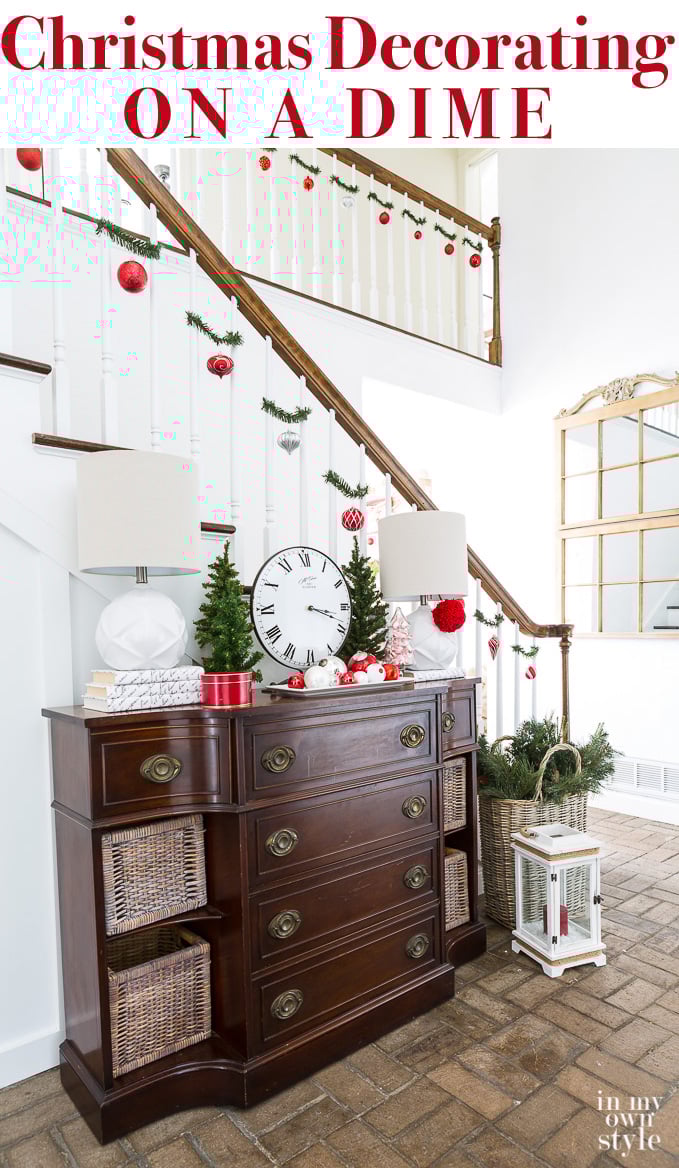 Christmas decorating ideas that are affordable, fast, and easy to do using garland ties. #Christmas #ChristmasDecorating #BudgetChristmas #ChristmasStaircase #HolidayFoyerDecor