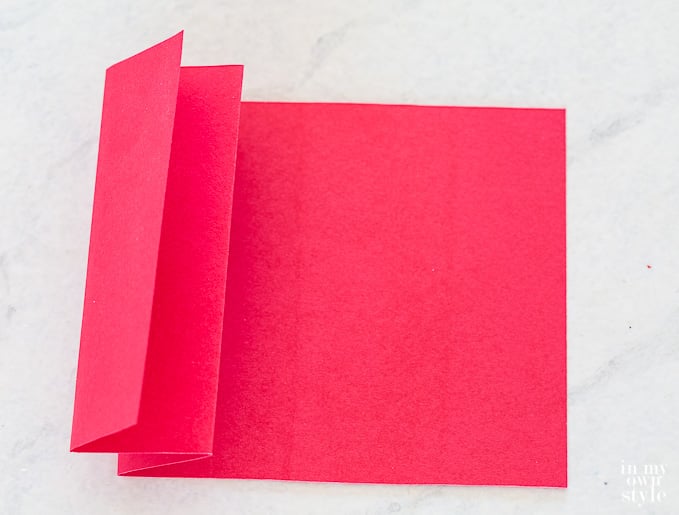 How to accordion fold paper to make a Christmas tree napkin ring.