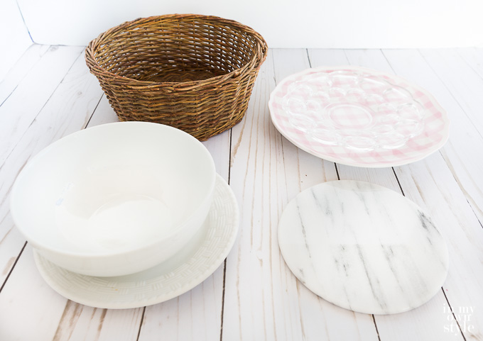 plates and a round basket to use on top of a candle holder