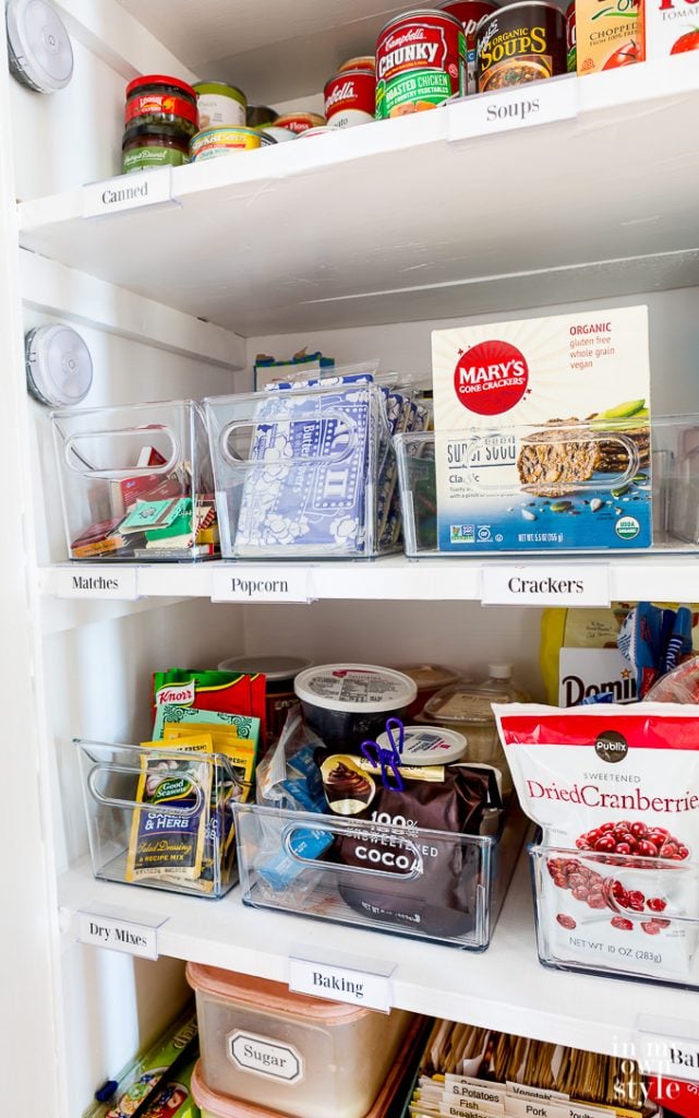 pantry shelves with labels telling where items should be placed