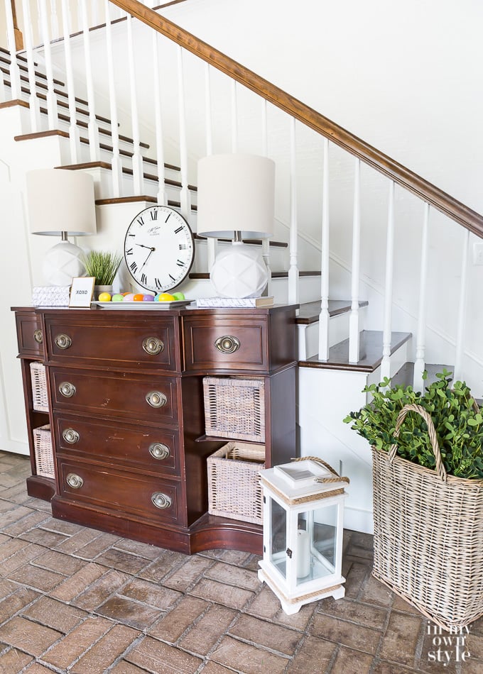 sideboard in foyer that needs refinishing