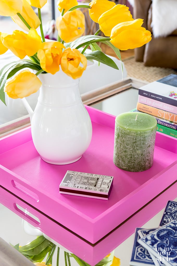 spring decorating on coffee table with pink wooden tray