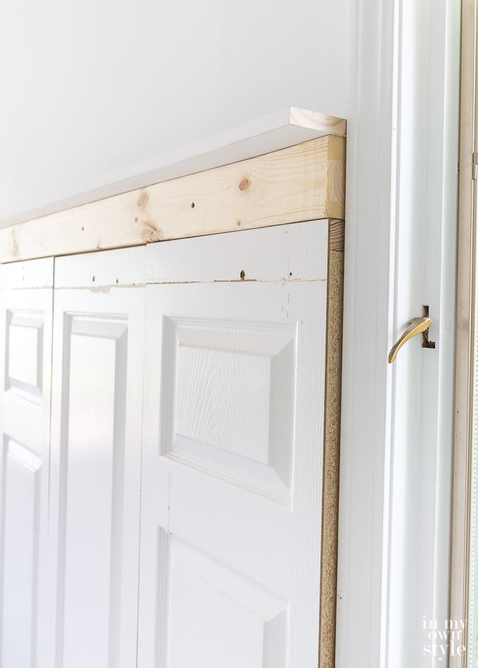 make a headboard using old doors and stock molding