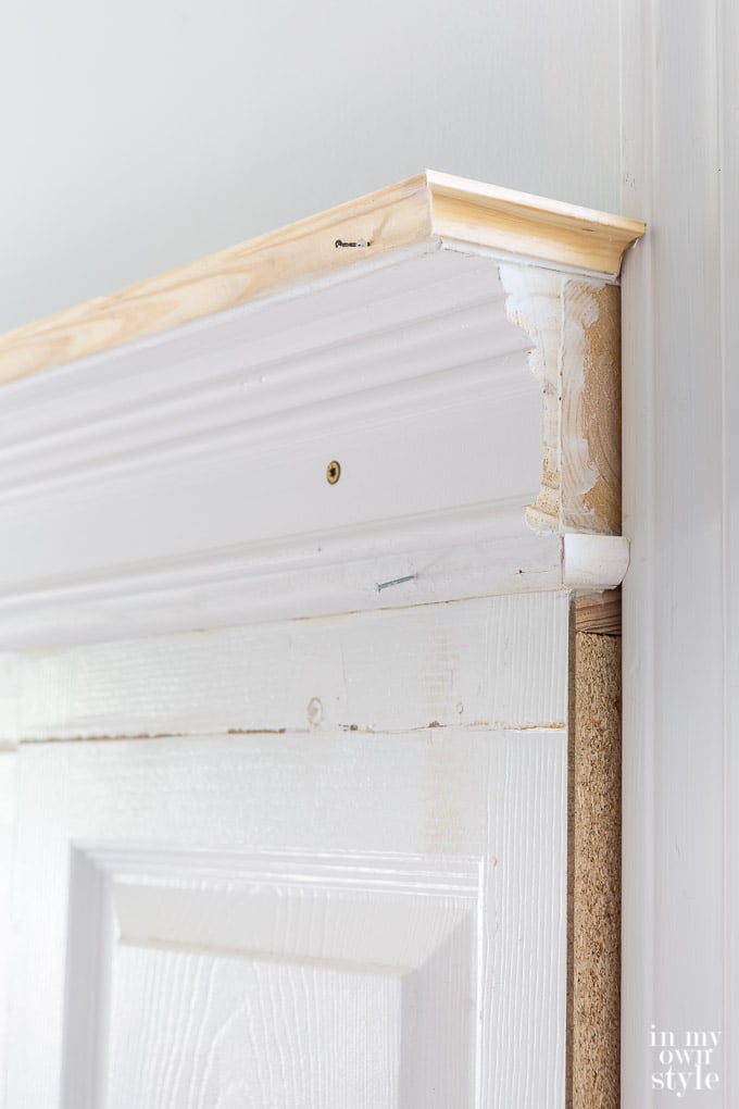 crown molding trim idea for top of an headboard made using old doors