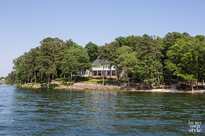 house nested in trees on lake