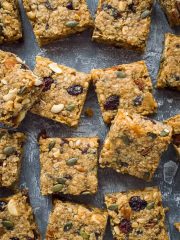 Vegan fruit and nut flapjacks - easy vegan oaty flapjacks (oat cookie bars) filled with dried fruits, nuts and seeds. Perfect for snacking, lunchboxes and hiking!