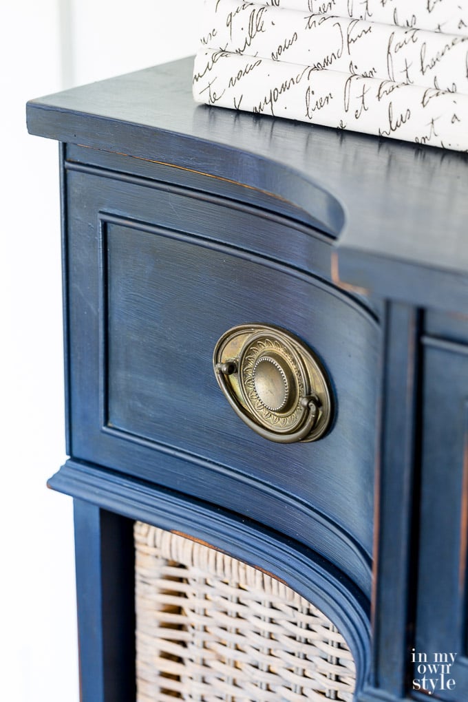 Navy blue chalk painted sideboard with books on top