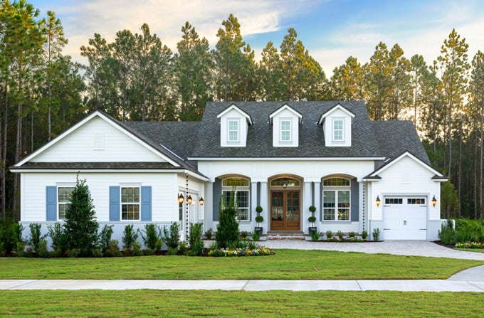 James Hardie white siding on house with blue shutters