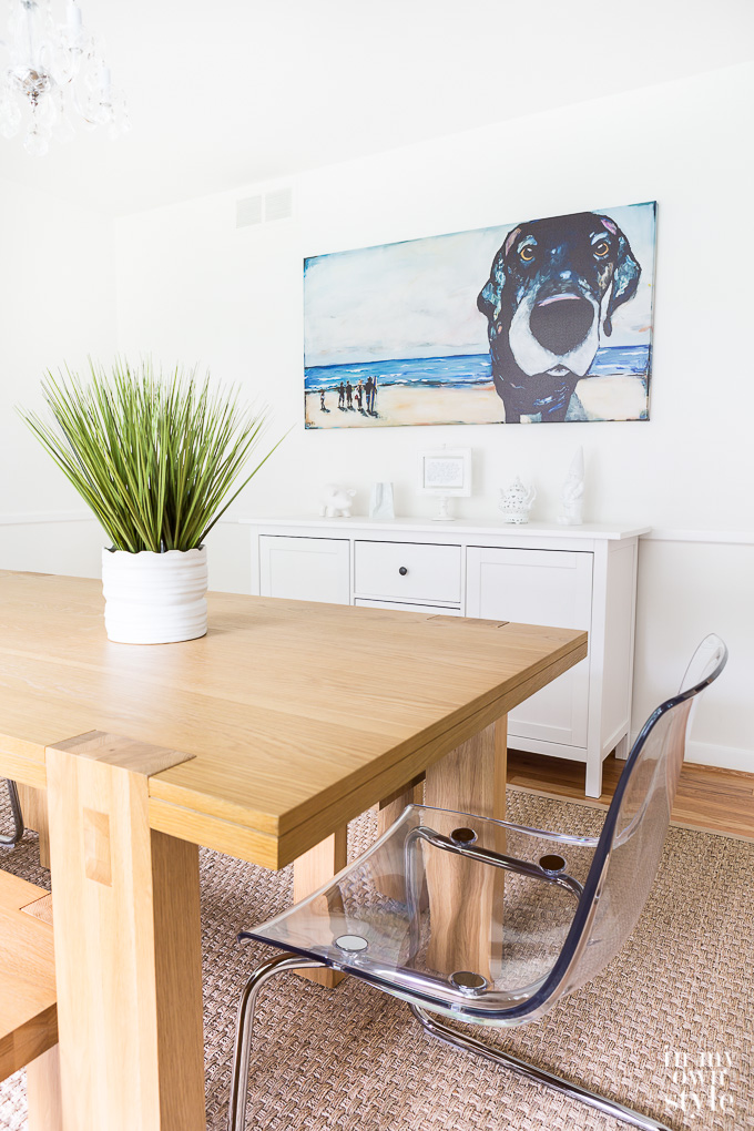 Dining room with dog art on wall
