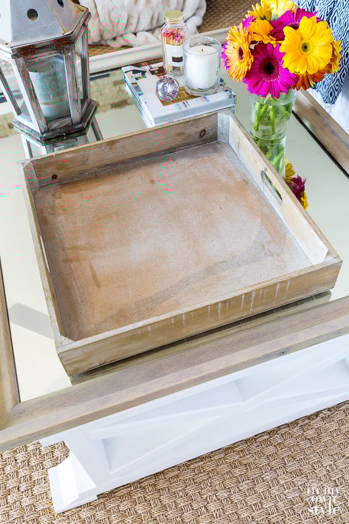 square wood tray on coffee table that is empty and waiting to be filled