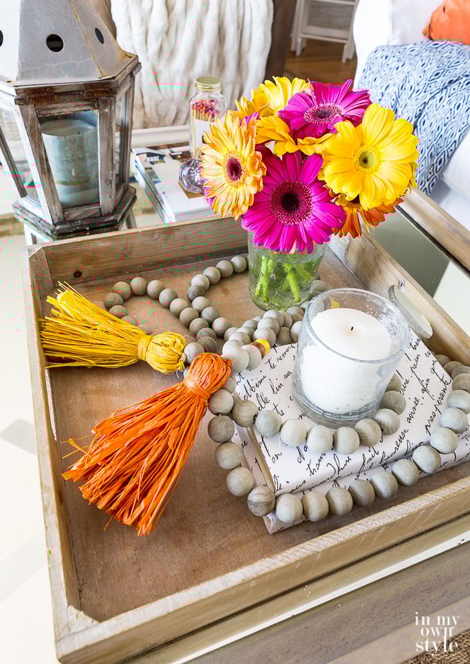 Tray on table decorated with a wood bead garland