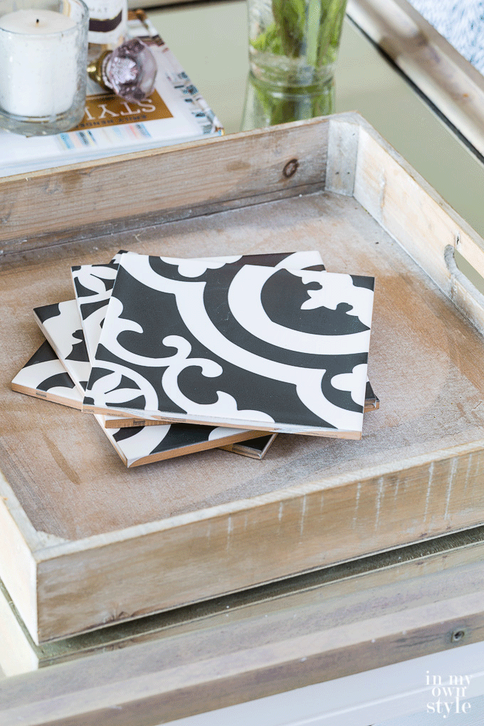 Animated gif image showing how to put decorative tiles in a tray