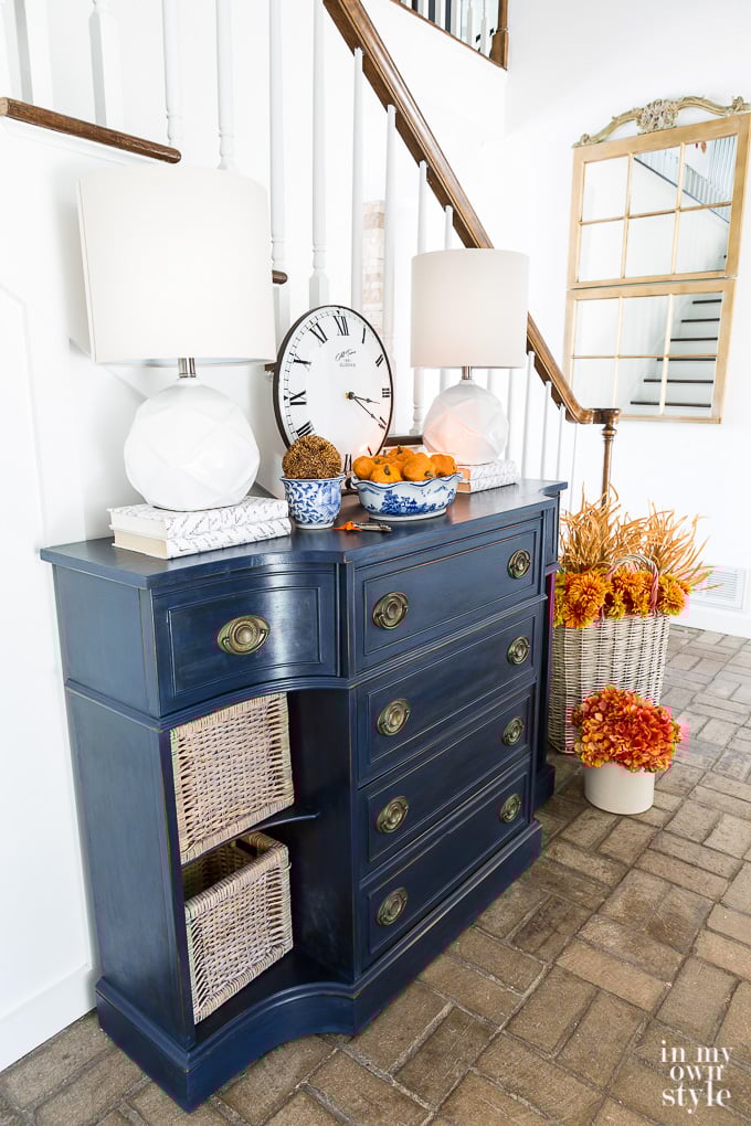 Blue sideboard in foyer all painted and decked out for fall.